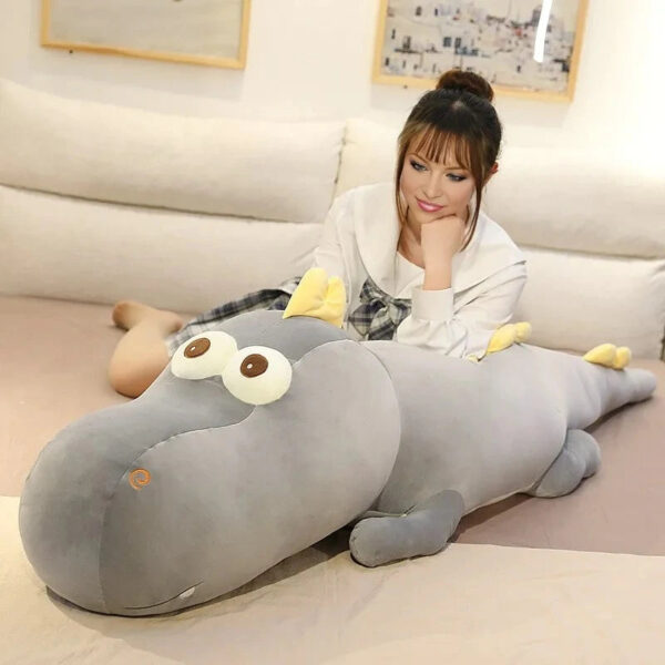 Peluche dinosaure bébé aux grand yeux