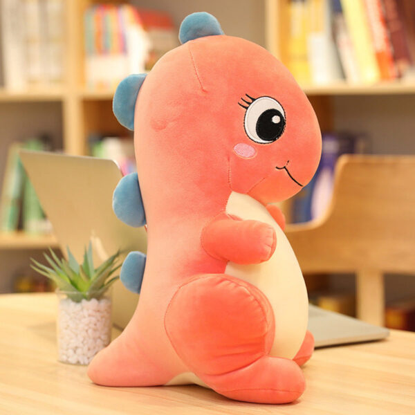 Peluche dinosaure jurassic world aux grands yeux