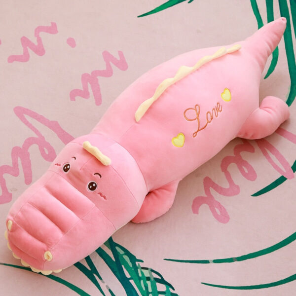 Gentille peluche dinosaure rose remplie de tendresse
