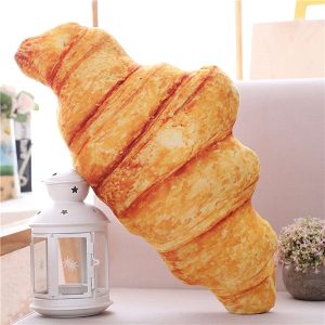 Coussin en peluche en forme de croissant